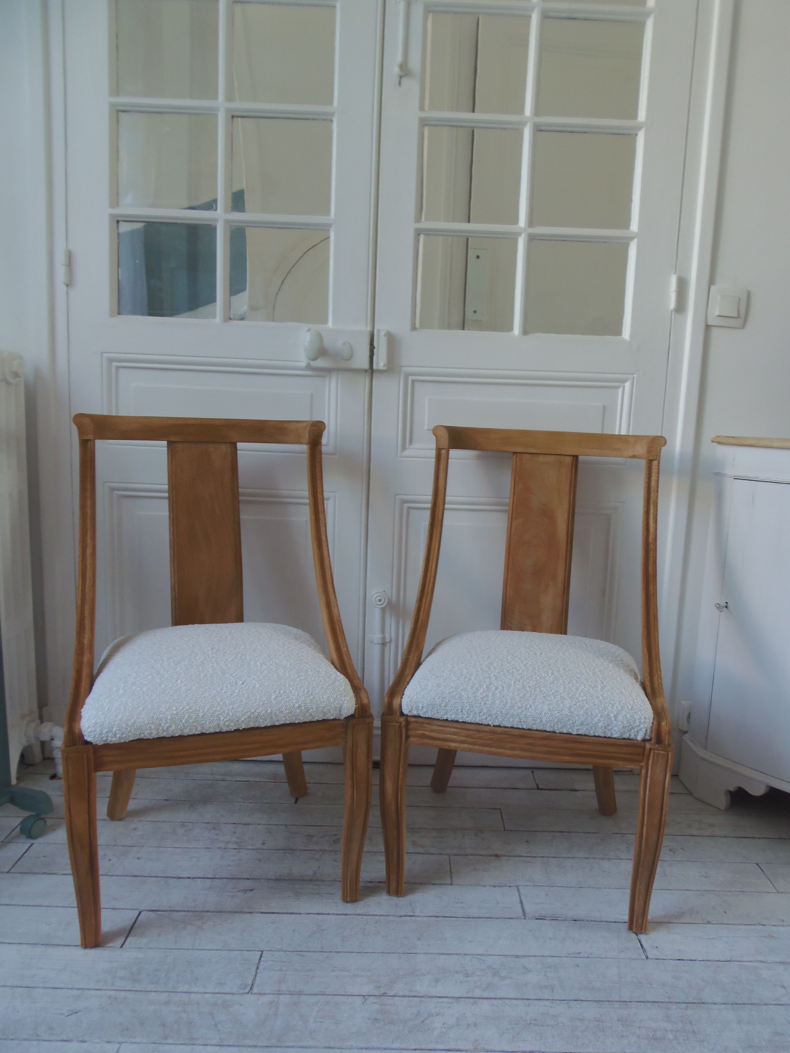 Pair of Gondola heaters, upholstered with a cream curl fabric