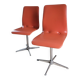2 orange faux leather swivel chairs