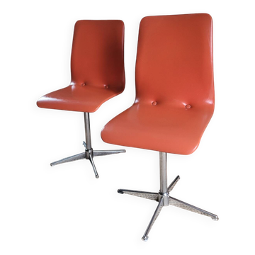 2 orange faux leather swivel chairs