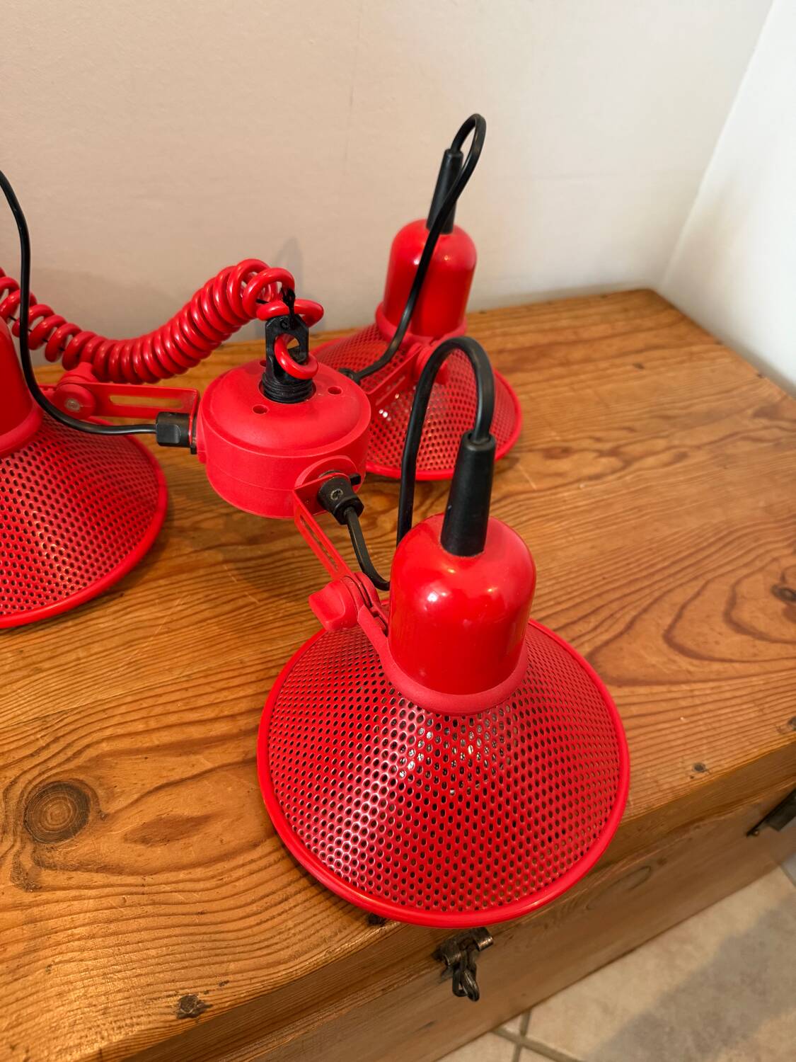 Three-lamp suspension in Memphis design style in red metal.