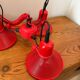 Three-lamp suspension in Memphis design style in red metal.