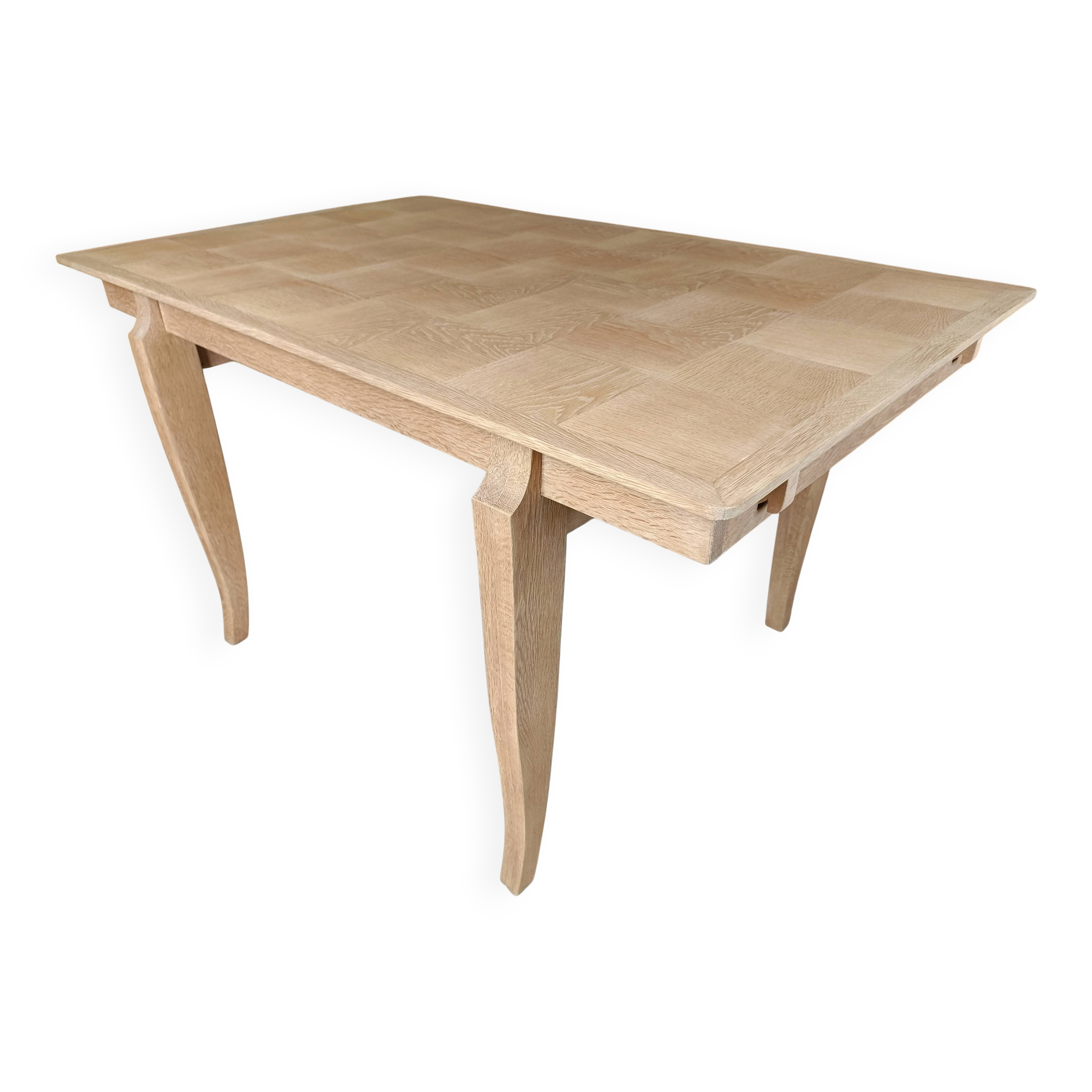 Oak dining table with a checkerboard top and extensions.