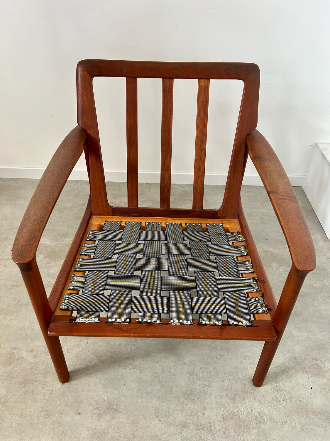 Old Scandinavian design armchair in vintage teak year 60