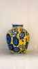 yellow porcelain vase with blue flowers