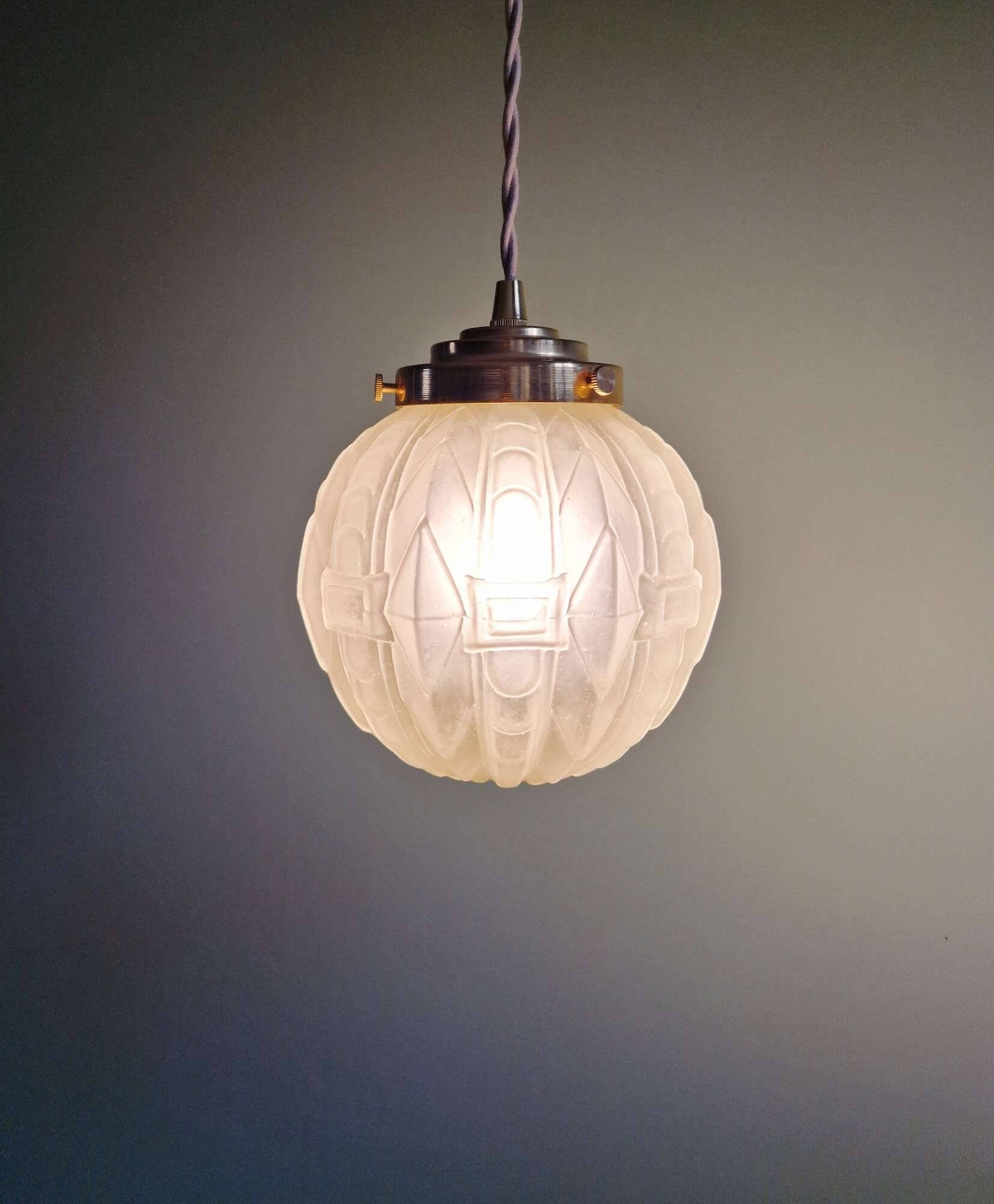 Pair of Art Deco pendant lights in pressed molded satin glass, 1920-30