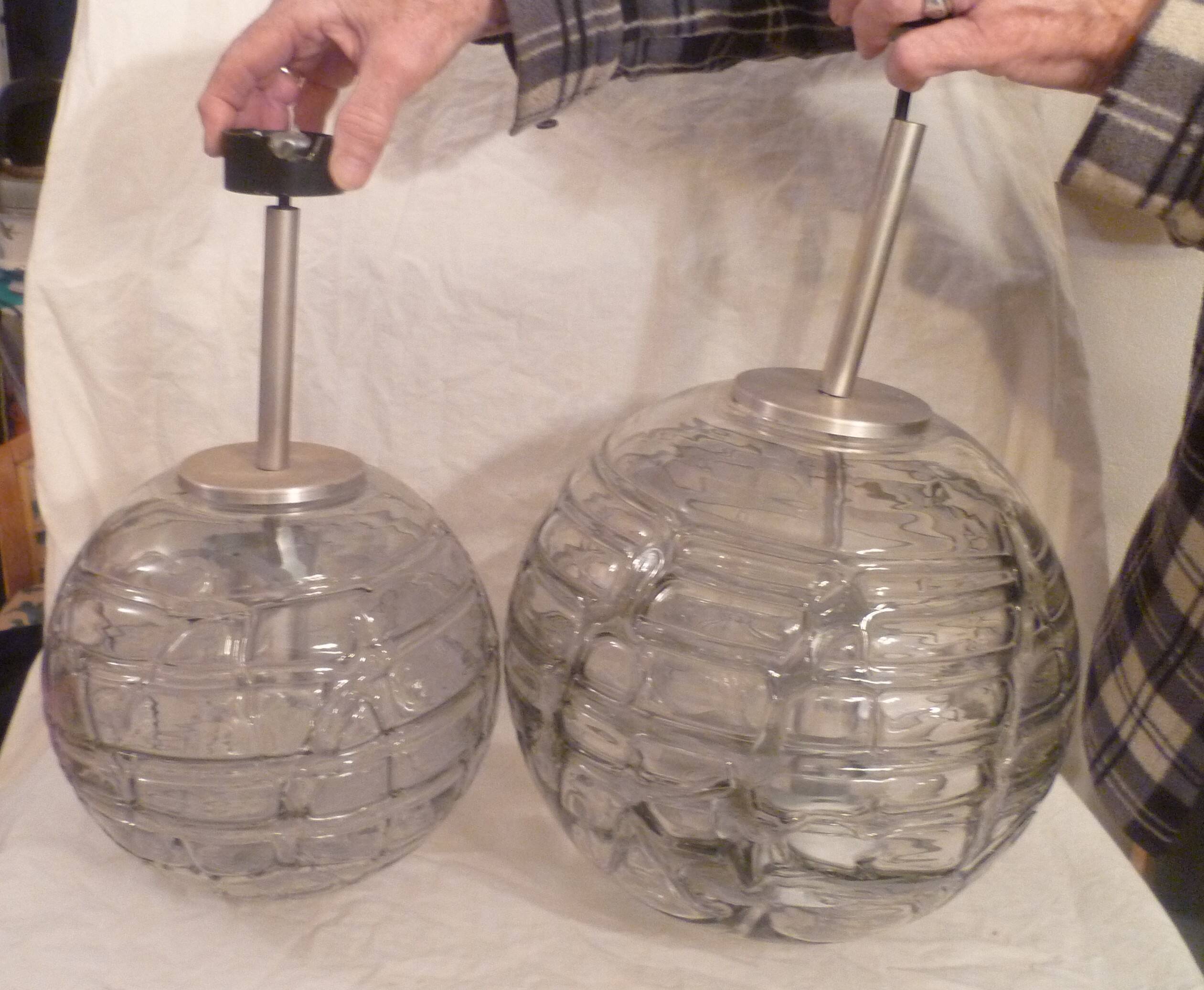 Set of 2 smoked glass ball suspensions by Doria Leuchten, Germany, 1970s.