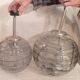 Set of 2 smoked glass ball suspensions by Doria Leuchten, Germany, 1970s.