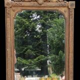 Old gilded mirror with pediment