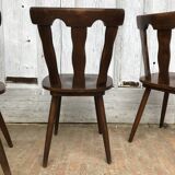4 wooden chairs with brutalist design