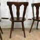 4 brutalist-style wooden chairs
