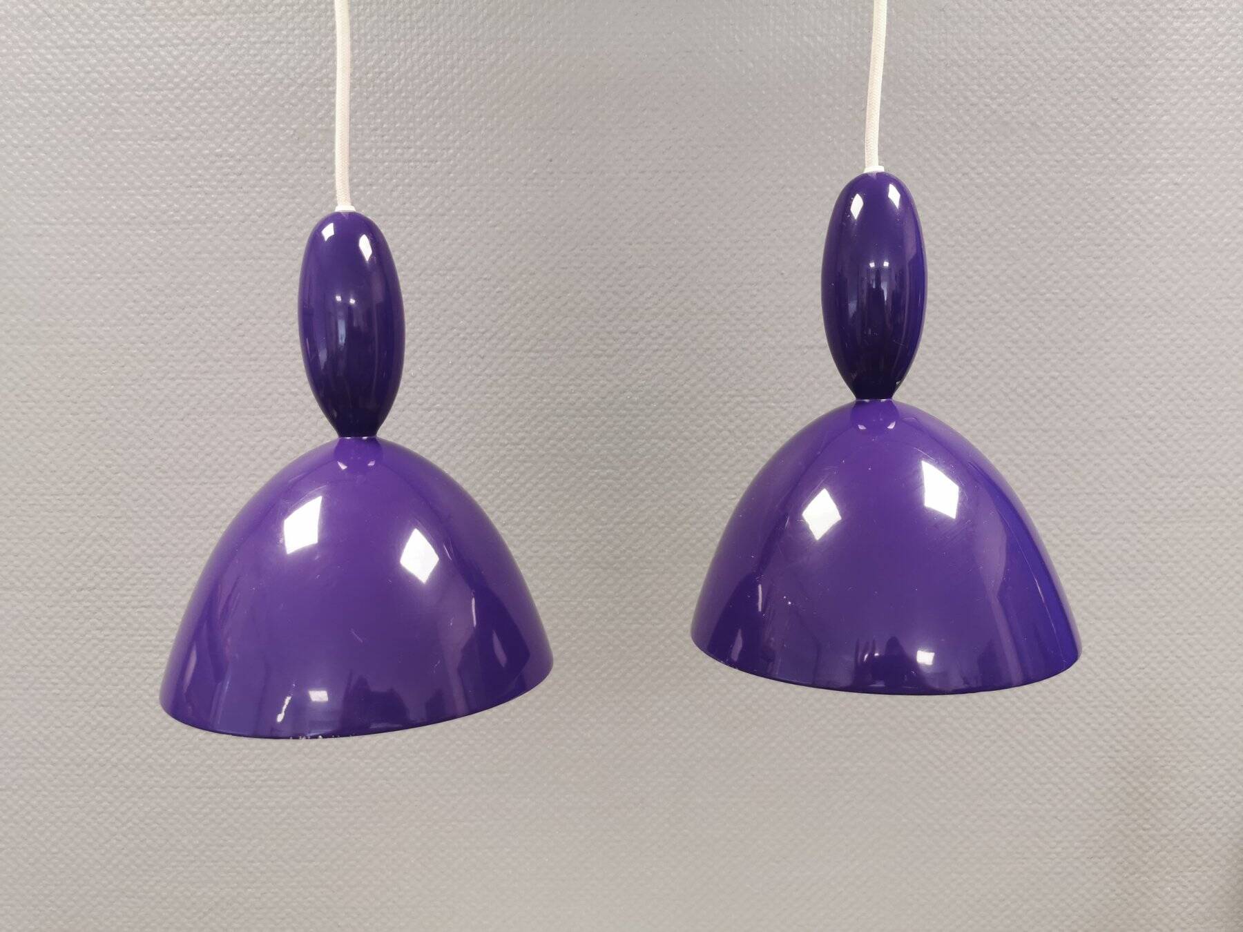 Two purple hanging lamps from Norway Says for Muuto, model Mhy