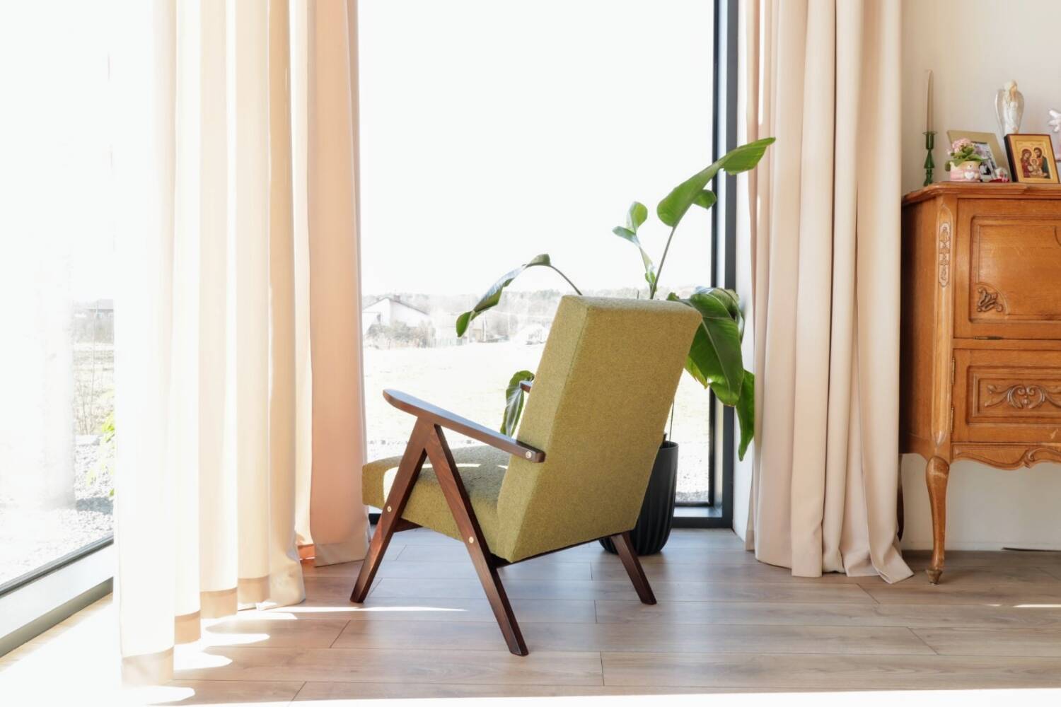 Vintage armchair in moss green bouclé design by H. Lis.