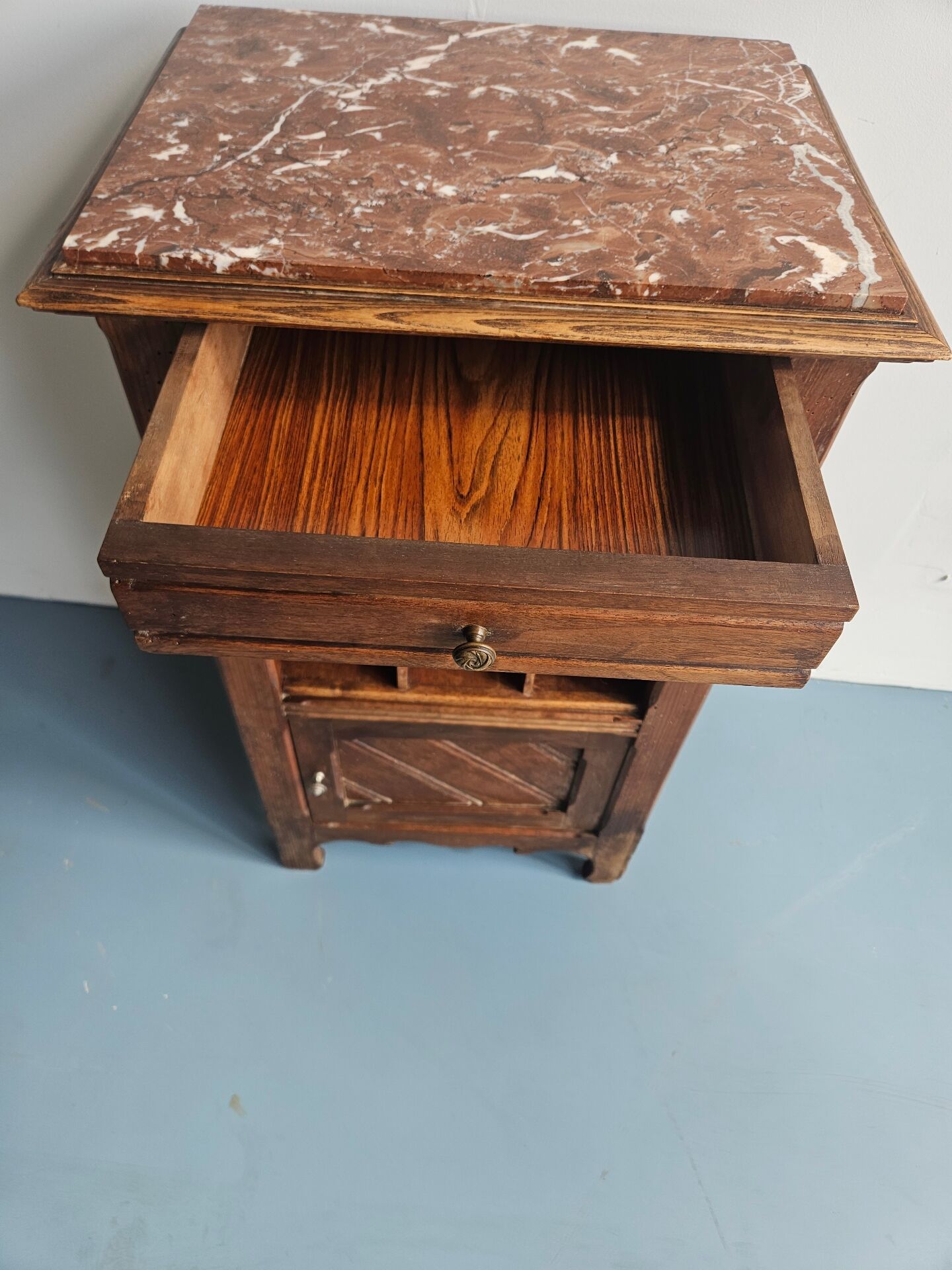 Wooden bedside table with book storage