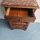 Wooden bedside table with book storage