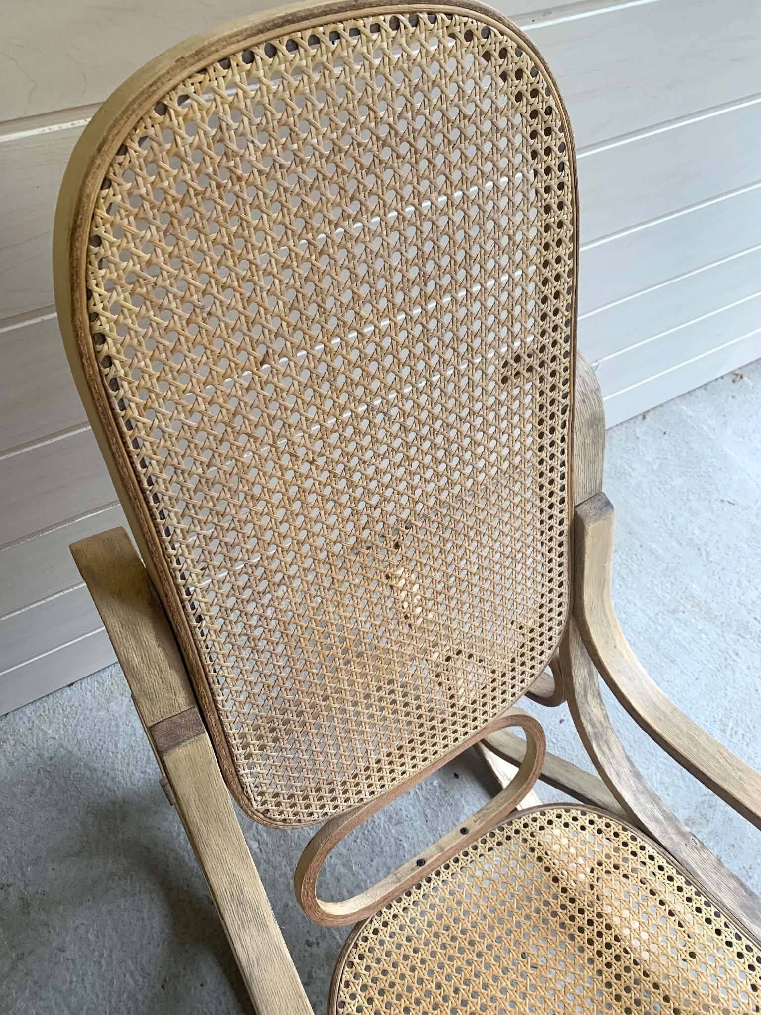 Rocking chair with a cane seat and backrest.