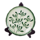 Badonviller plate with a guilloche pattern, green slipware.