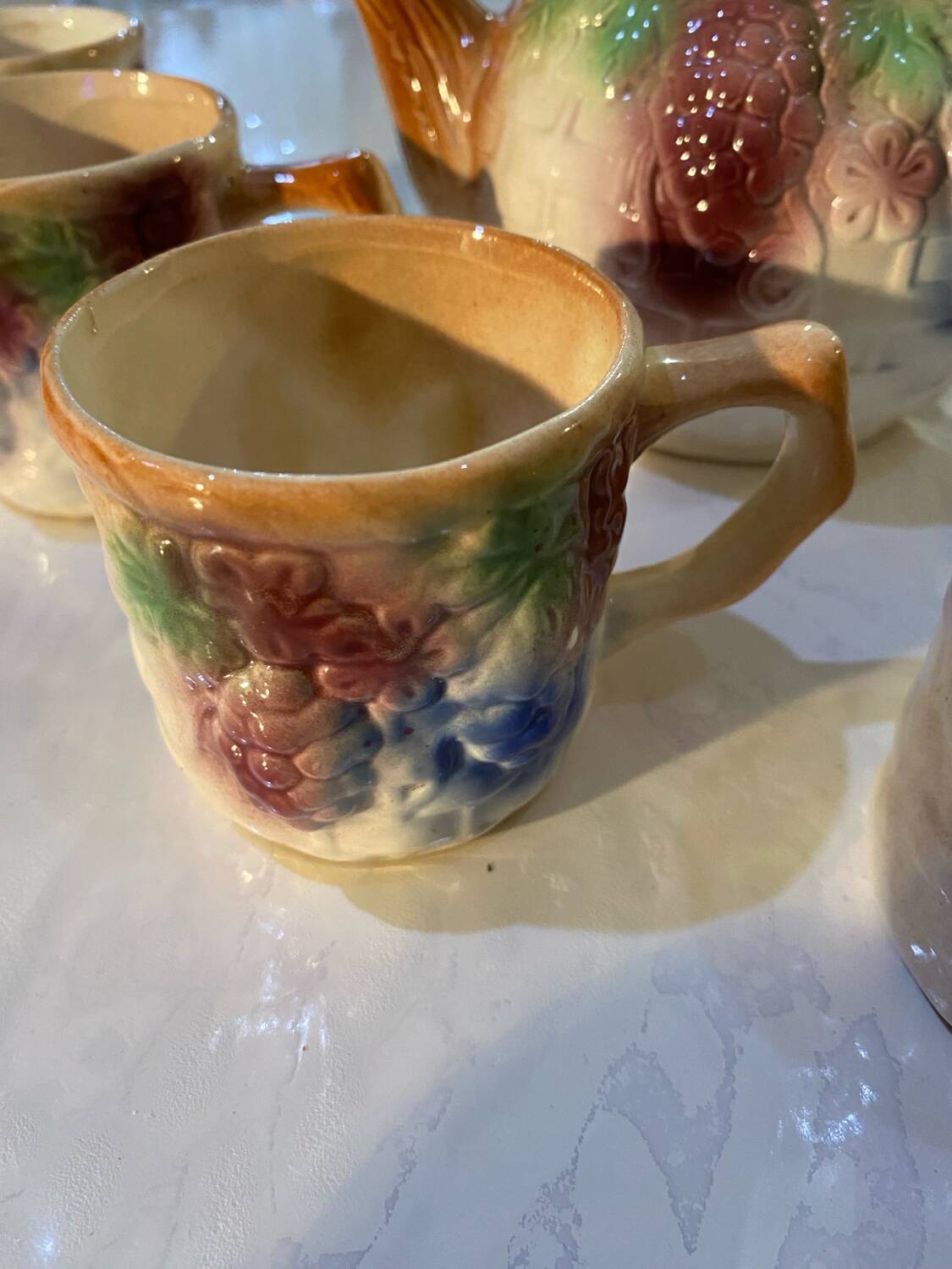 Vintage earthenware teapot and cup set