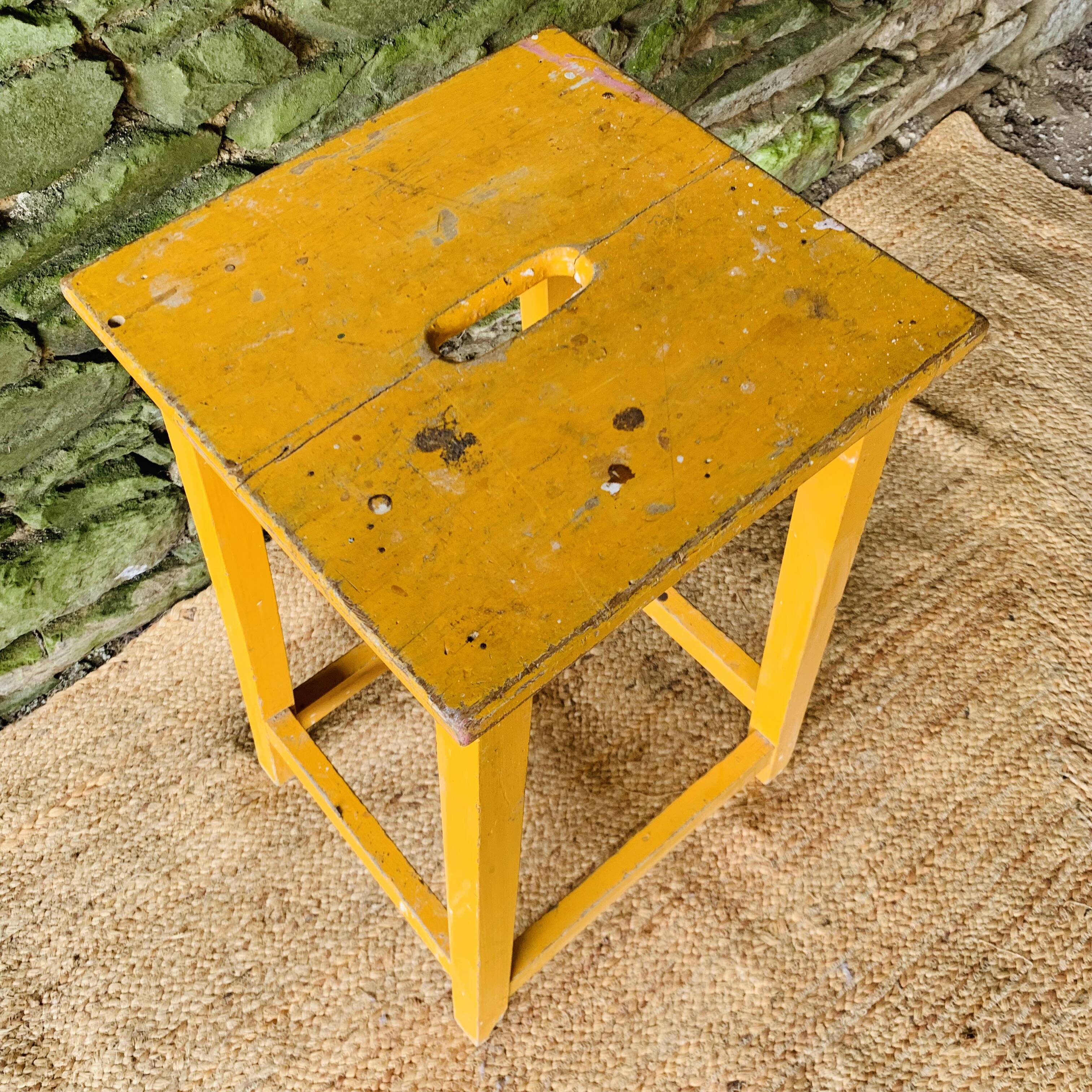 Yellow wooden high stool