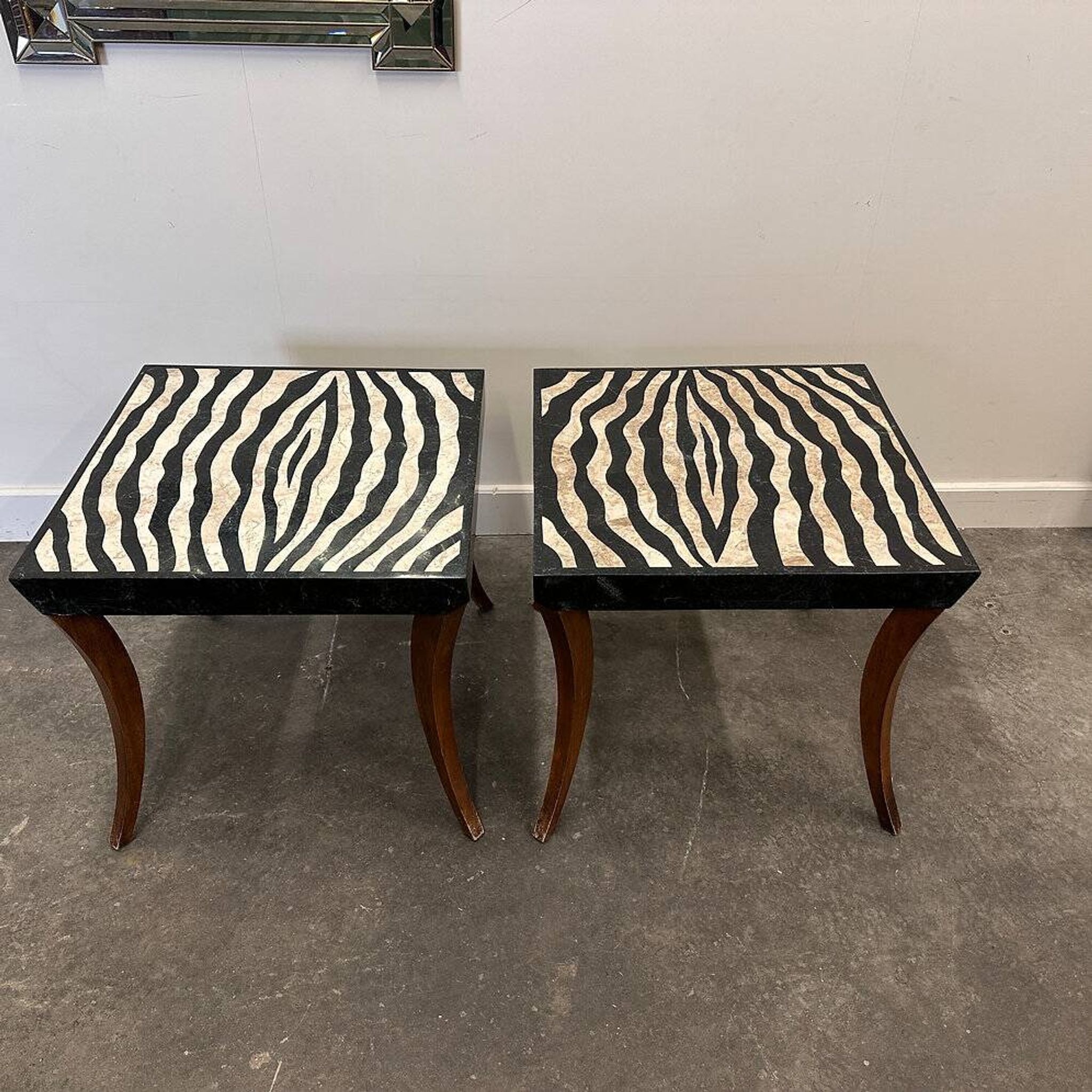 Striking pair of Italian zebra inlaid tessellated stone tables with refined curves