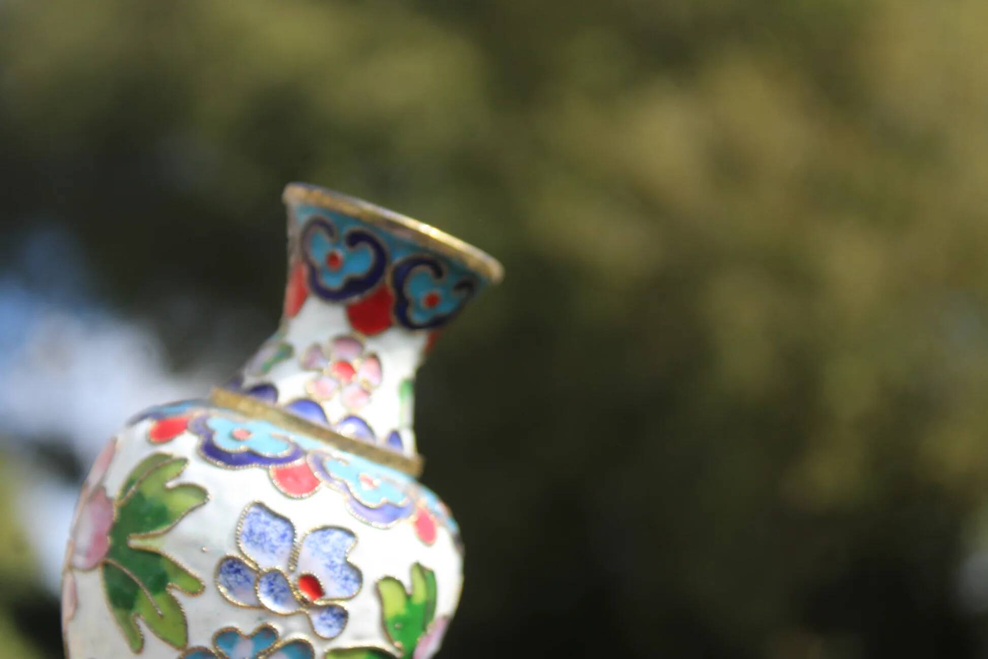 Two small vintage cloisonné enamel vases with Asian floral decoration.