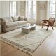 Berber wool rug with abstract white patterns