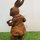 Rabbit with a cast iron pipe garden statue