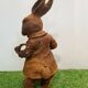 Rabbit with a cast iron pipe garden statue