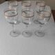 Set of 6 glasses with gold band decorations.