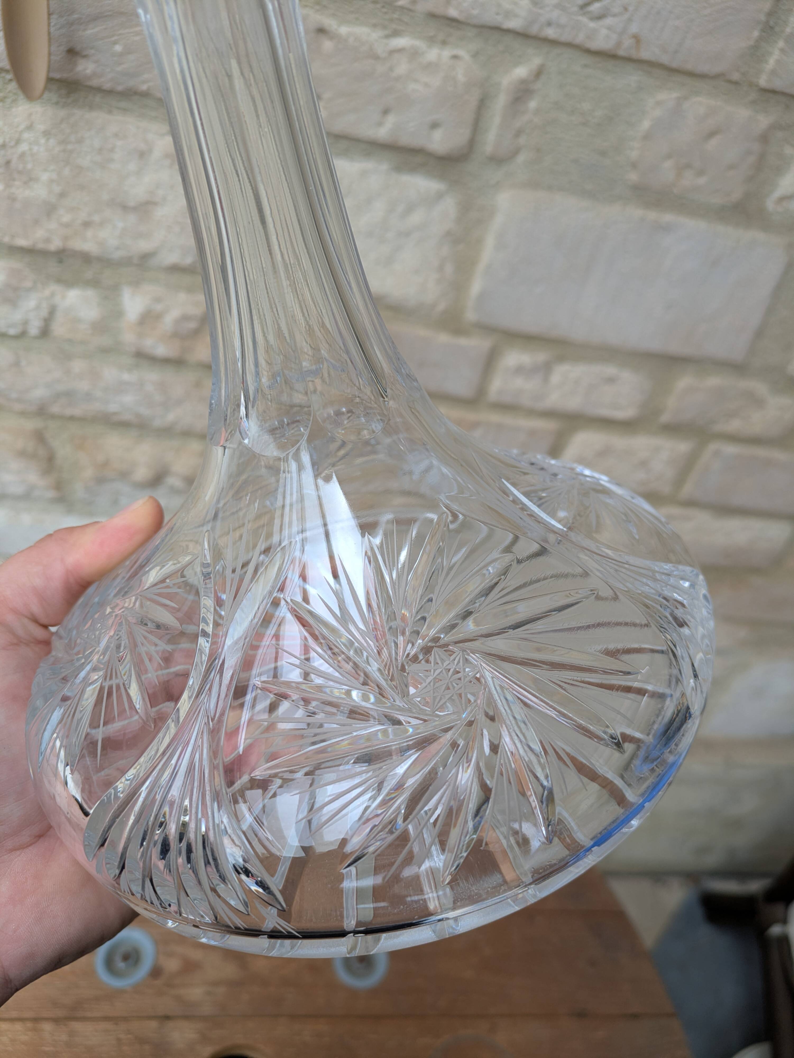 Antique cut crystal decanter with stopper.