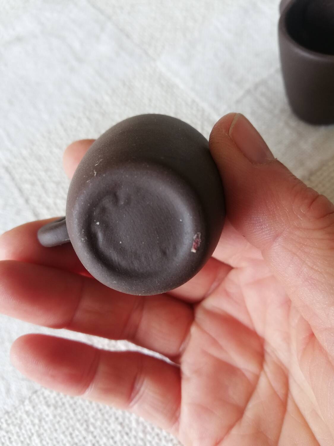 Set of three matte brown ceramic cups for dolls' play kitchen