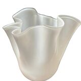 White glass vase in corolla shape