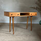 Vintage desk with compass legs in oak