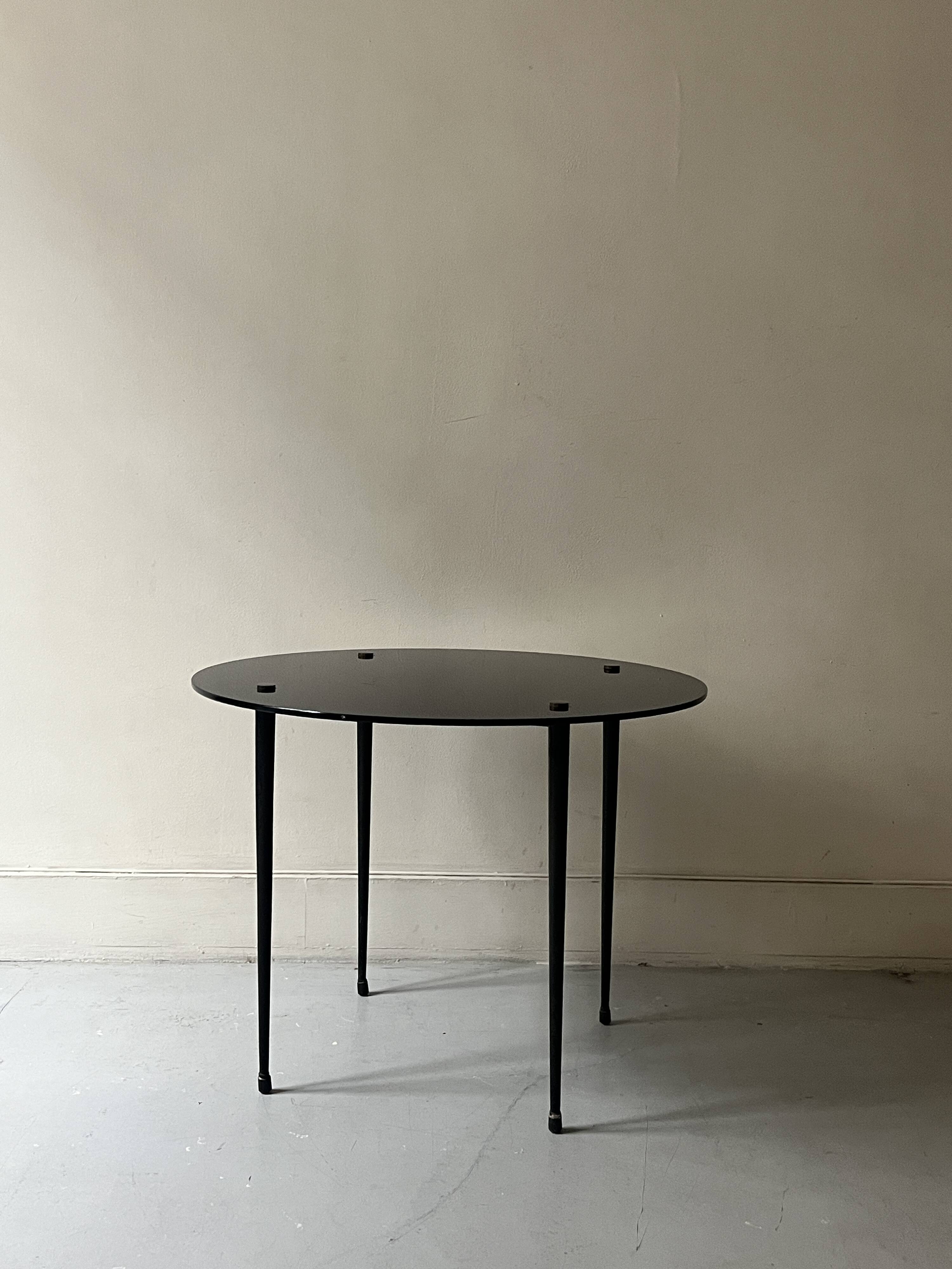 Vintage round black glass coffee table, 1950s