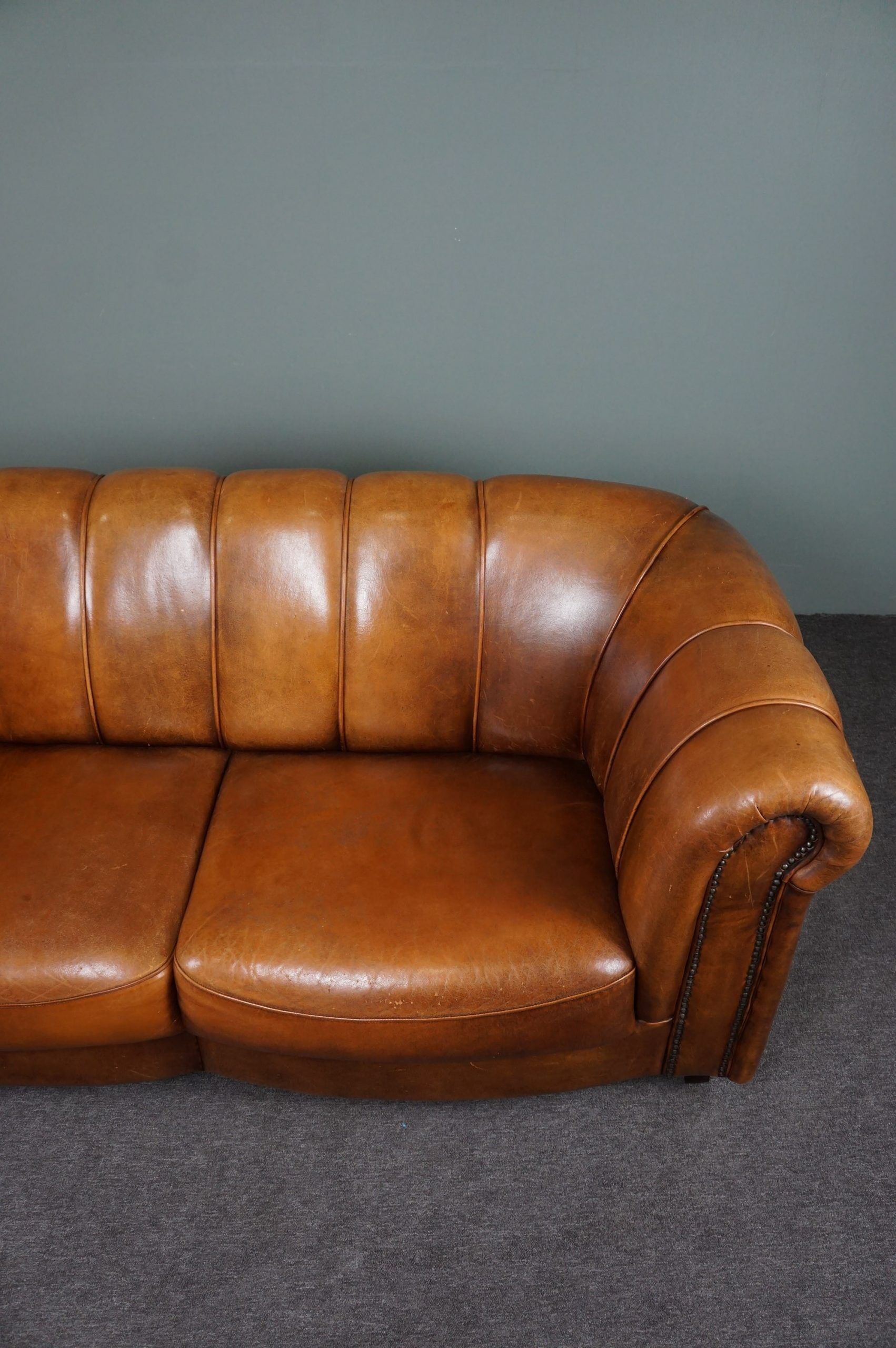 Sheepskin sofa with decorative nails
