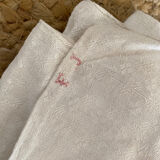 Old white cotton tablecloth.