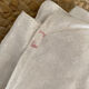 Old white cotton tablecloth.