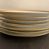 7 flat plates in porcelain of Limoges Bernardaud, decoration of golden Greek, XXth century