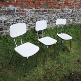 3 old white Formica chairs