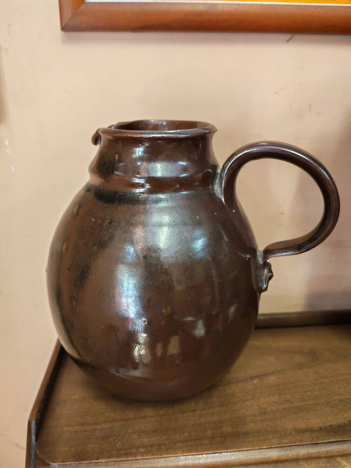 Set of three vintage ceramic jugs and a pitcher.
