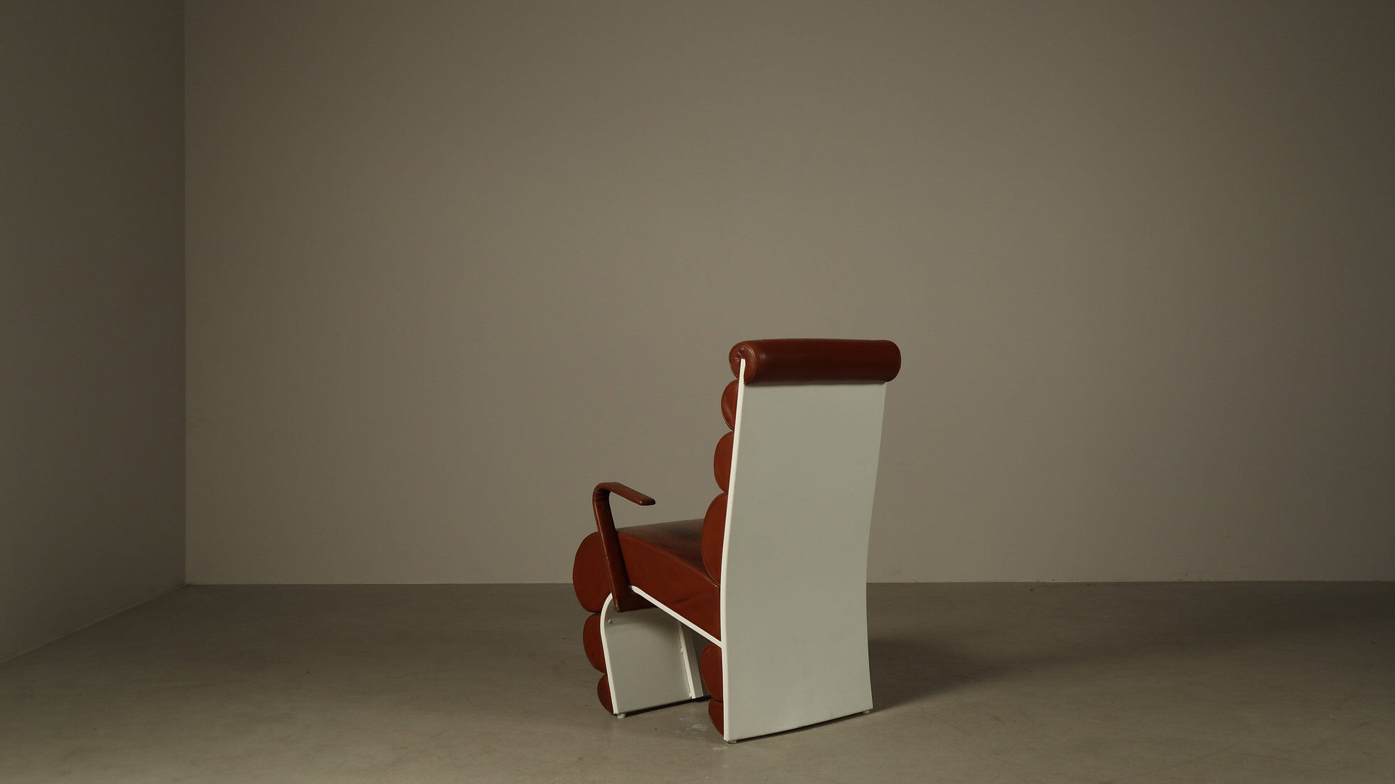 Pair of sculptural cognac leather armchairs, 1970s