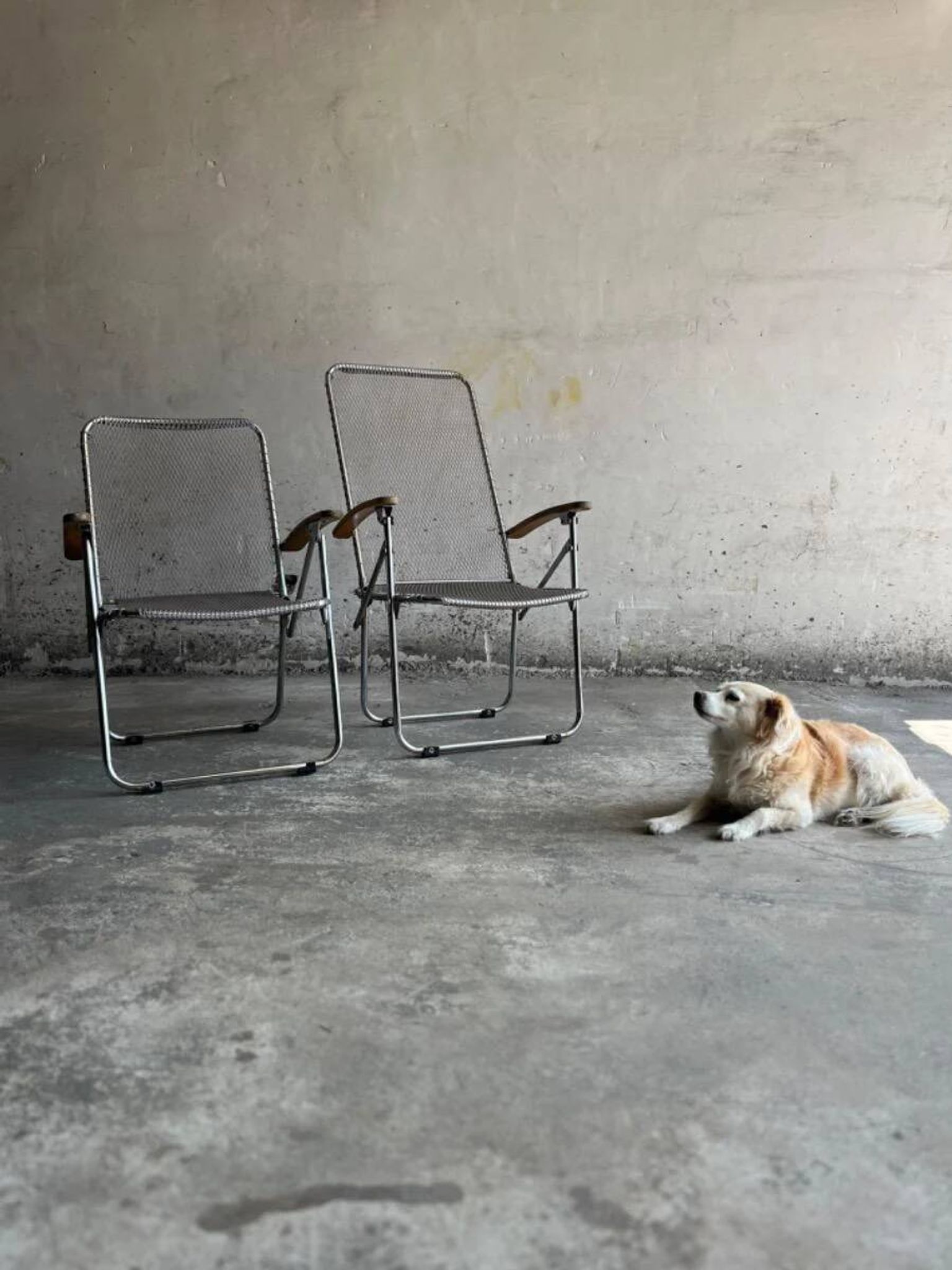 Set of two vintage folding chairs with an aluminium wire frame.
