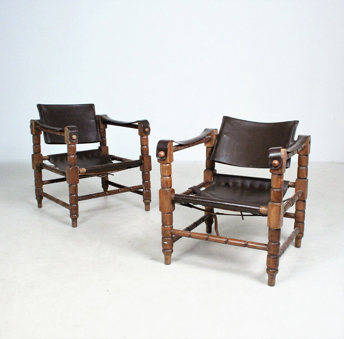 Pairs of vintage Safari style armchairs in wood and leather
