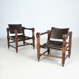 Pairs of vintage Safari style armchairs in wood and leather