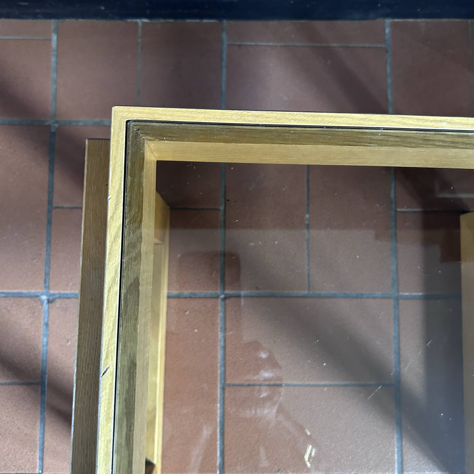 Modernist side table in wood and smoked glass