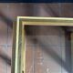 Modernist side table in wood and smoked glass