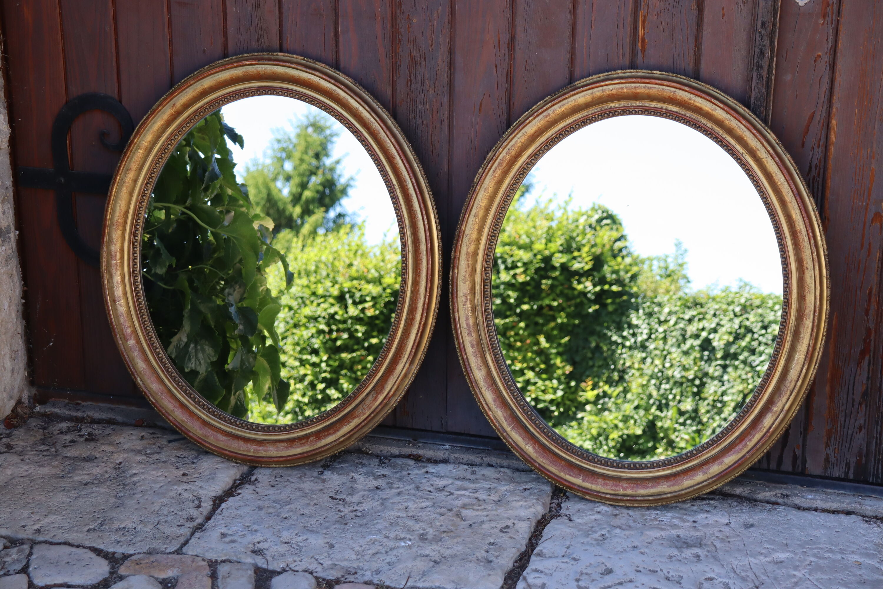 Pair of oval mirrors from the Louis Philippe period in gilded wood.