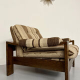 2 vintage 1970s wooden and fabric armchairs