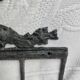 Patinated metal wall bracket and porcelain