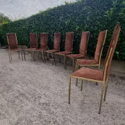 8 vintage 1970s chairs in brass and velvet with high backs.