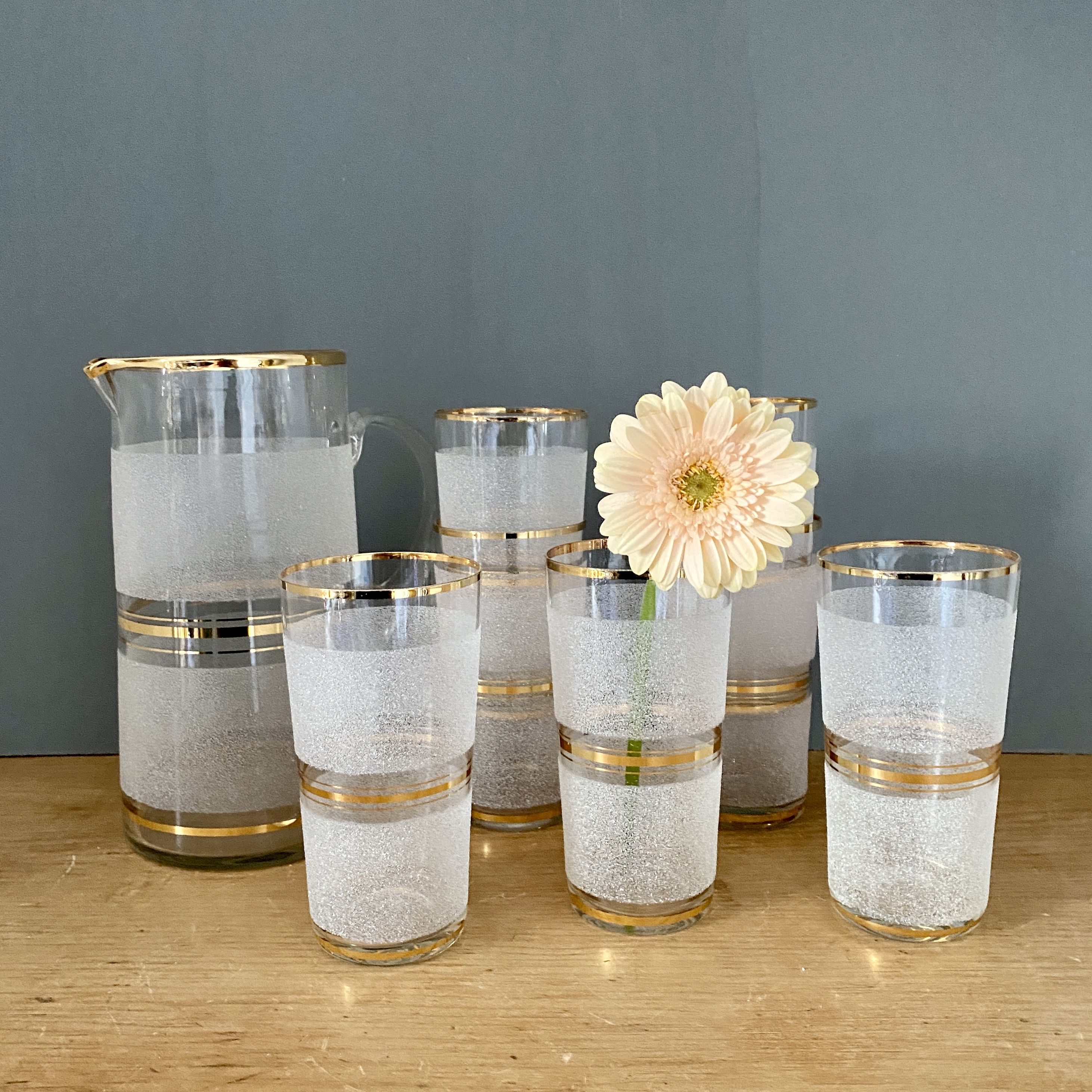 Vintage orangeade service in white granite glass and golden edging